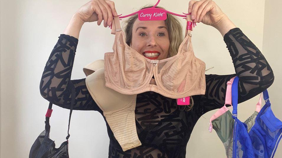 She Hooks A Pink Scarf To The Side Of Her Bra. What She Turns It